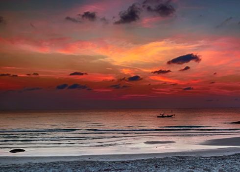 Small fishing boat in sea sunrise or sunset background abstract blur