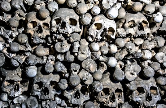 Pile Human skeleton skulls background horror concept