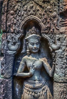 Carvings Apsara sculpture ruins temple Angkor Wat in Cambodia