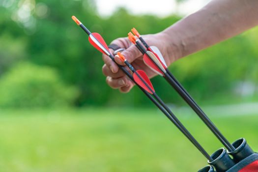 pulling an arrow out of the holster at archery races