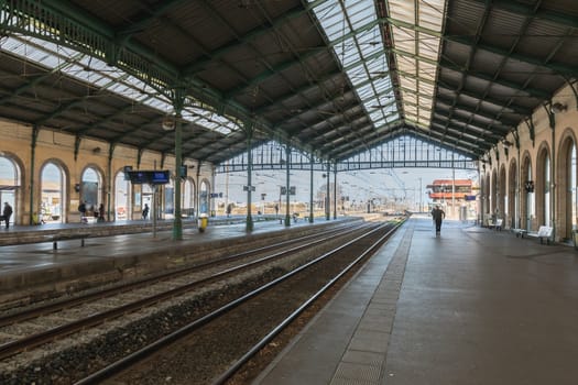 Sete, France - January 4, 2019: traveler walking on the platforms of the city train station on a winter day