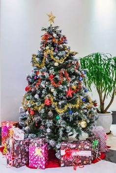 Christmas holidays new year tree gifts atmosphere in house indoors, background blur textures soft focus