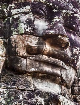 smile stone faces Bayon Temple Angkor Thom Cambodia. Ancient Khmer architecture.