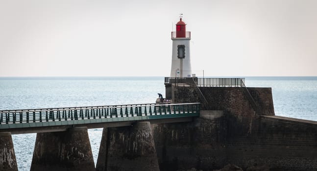 View of the Lighthouse of the Grande Jetée (large pier) at the exit of the port of Sables d Olonnes, France