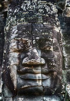 old stone face of prasat Bayon Temple Angkor Thom Cambodia.