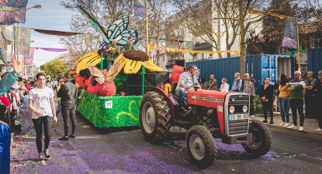 Loule, Portugal - February 25, 2020: Float parading in the street in front of the public in the parade of the traditional carnival of Loule city on a February day