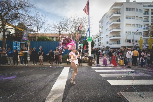 Loule, Portugal - February 25, 2020: dancers parading in the street in front of the public in the parade of the traditional carnival of Loule city on a February day