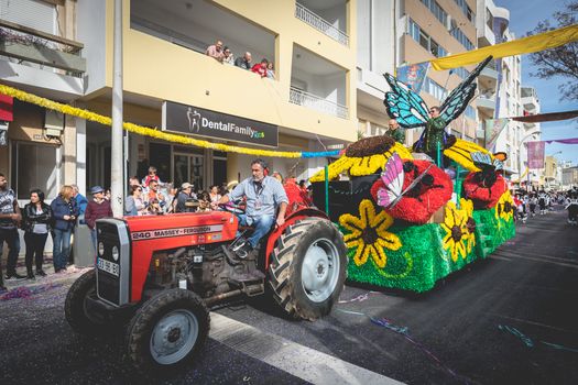 Loule, Portugal - February 25, 2020: Float parading in the street in front of the public in the parade of the traditional carnival of Loule city on a February day