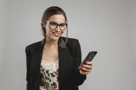 Beautiful woman checking her cellphone