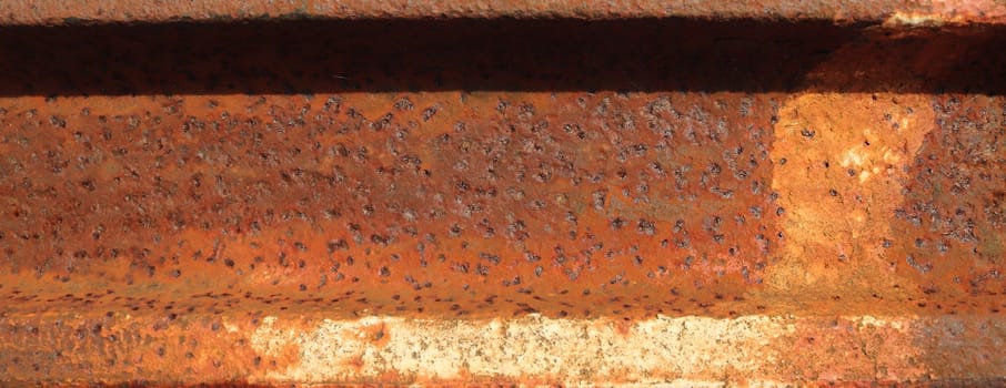 Detailed close up surface of rusty metal and steel with lots of corrosion in high resolution.