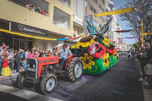 Loule, Portugal - February 25, 2020: Float parading in the street in front of the public in the parade of the traditional carnival of Loule city on a February day