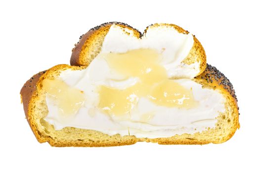 Top view of slice of challah bread with cottage cheese and honey isolated on white background with clipping path
