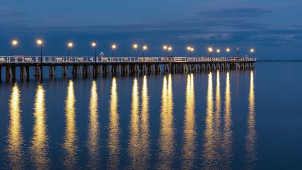 Panoramic view of wooden pier in Gdynia Orlowo in Poland at dusk