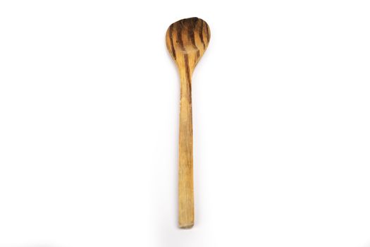 wooden kitchen spoon on white background in studio