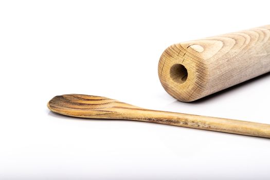 wooden spoon and rolling pin on white background in studio