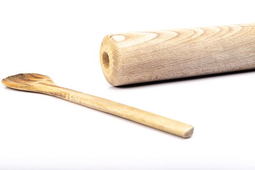 wooden spoon and rolling pin on white background in studio