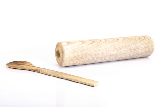 wooden spoon and rolling pin on white background in studio