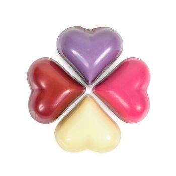 Colorful heart shaped chocolates isolated on white background with clipping path
