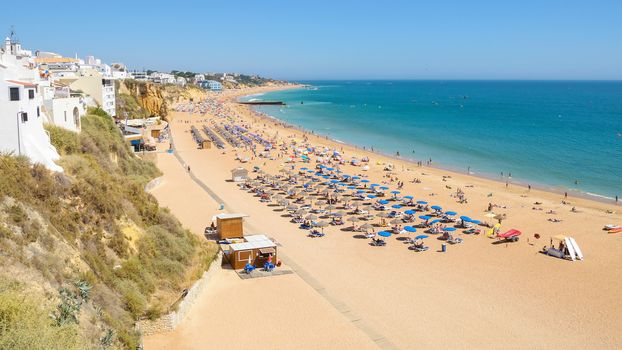 View of sunny public beach in Albufeira, Algarve, Portugal