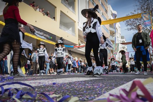 Loule, Portugal - February 25, 2020: dancers parading in the street in front of the public in the parade of the traditional carnival of Loule city on a February day