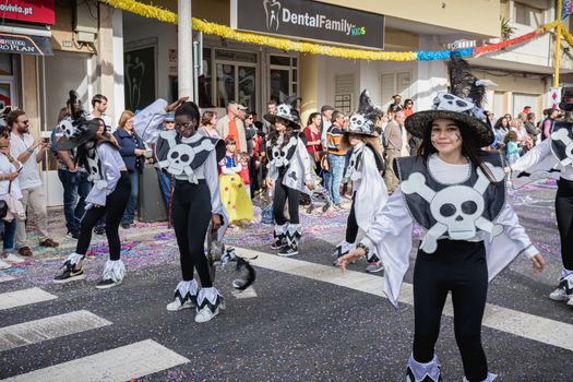 Loule, Portugal - February 25, 2020: dancers parading in the street in front of the public in the parade of the traditional carnival of Loule city on a February day