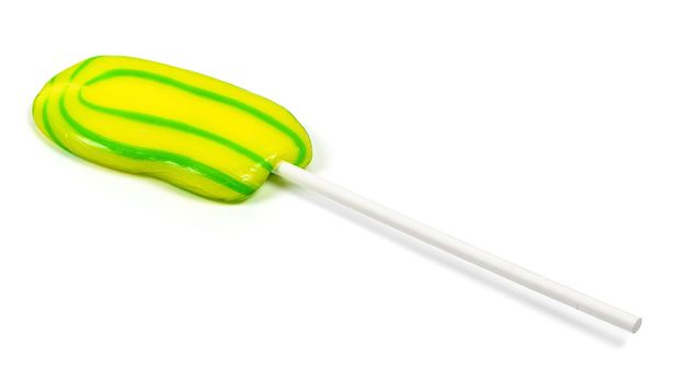 Yellow-green lollipop isolated on white background with clipping path