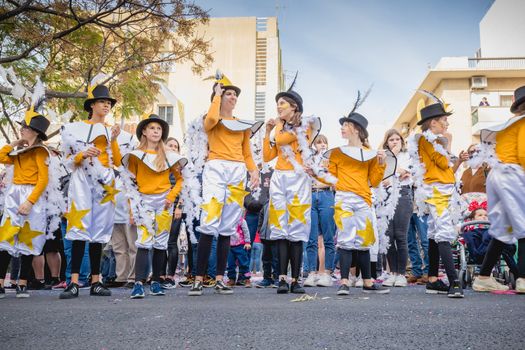 Loule, Portugal - February 25, 2020: dancers parading in the street in front of the public in the parade of the traditional carnival of Loule city on a February day