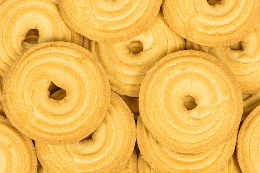 Heap of butter cookies as background