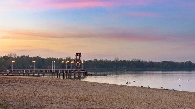 Evening autumn view of beach and pier at Pogoria III lake in Dabrowa Gornicza, Poland