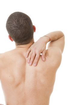 rear view of a young man holding his back in pain, isolated on white background