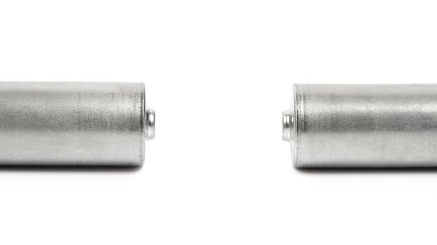 Close up of the positive poles of two batteries isolated on white background with clipping path