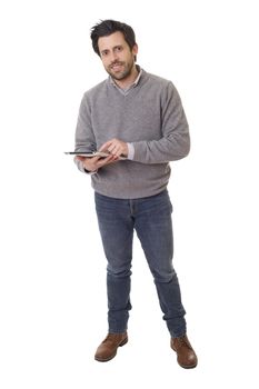 casual man full length, working with his tablet pc, isolated