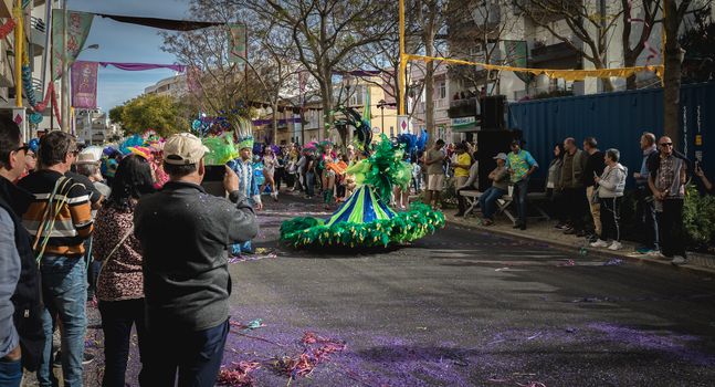 Loule, Portugal - February 25, 2020: dancers parading in the street in front of the public in the parade of the traditional carnival of Loule city on a February day