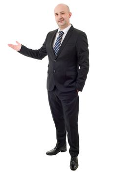 Handsome businessman with arm out in a welcoming gesture, isolated on white