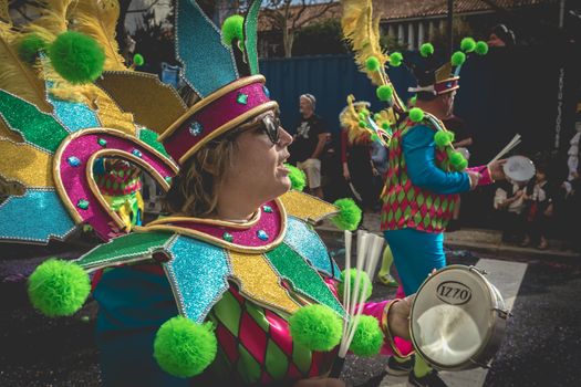 Loule, Portugal - February 25, 2020: percussionists parading in the street accompanying dancers in the parade of the traditional carnival of Loule city on a February day