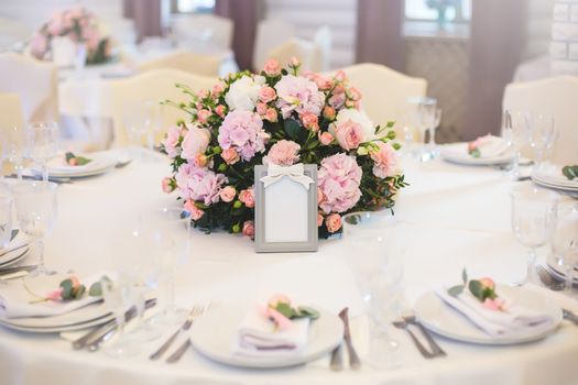 Guest table, with bouquet from petals and a number