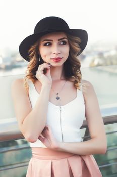 Close-up Fashion woman portrait of young pretty trendy girl posing at the city in Europe,spring fall street fashion,looking to the side and smiling portrait.trendy.