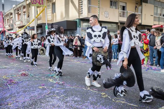 Loule, Portugal - February 25, 2020: dancers parading in the street in front of the public in the parade of the traditional carnival of Loule city on a February day