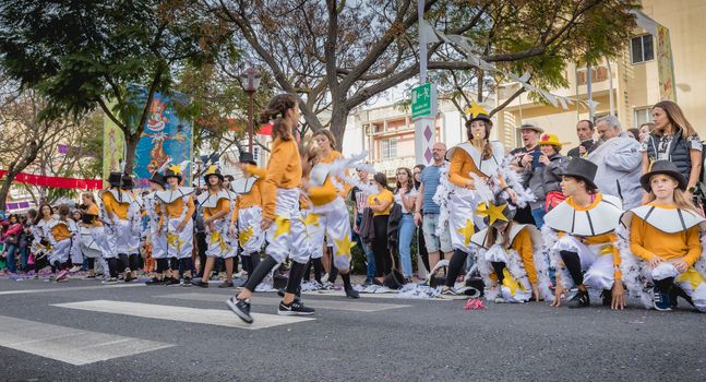 Loule, Portugal - February 25, 2020: dancers parading in the street in front of the public in the parade of the traditional carnival of Loule city on a February day