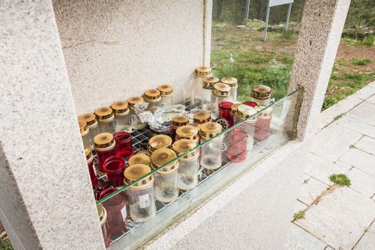 Vila Cha near Esposende, Portugal - May 9, 2018: candlestick protected by a glass outside the chapel of S. Lourenco on the heights of the city on a spring day