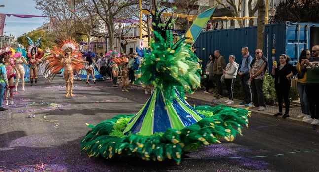 Loule, Portugal - February 25, 2020: dancers parading in the street in front of the public in the parade of the traditional carnival of Loule city on a February day