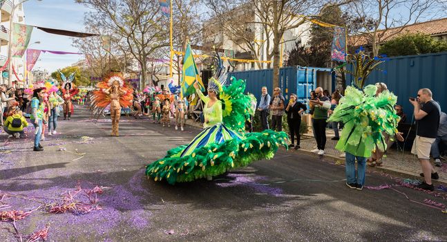 Loule, Portugal - February 25, 2020: dancers parading in the street in front of the public in the parade of the traditional carnival of Loule city on a February day