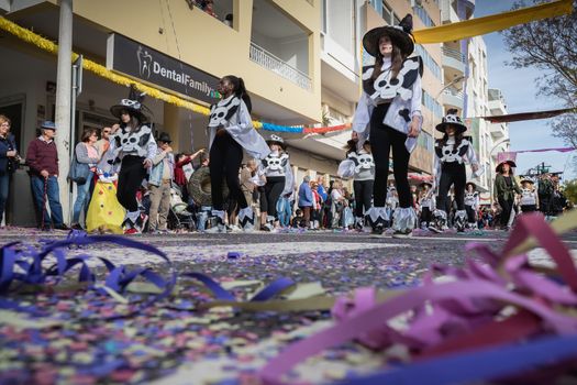 Loule, Portugal - February 25, 2020: dancers parading in the street in front of the public in the parade of the traditional carnival of Loule city on a February day