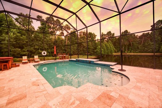 A Swimming Pool at Sunset with a Lake View