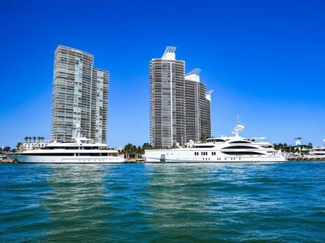 2 large yachts and 2 modern buildings