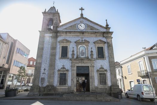 Ovar, Portugal - February 18, 2020: architectural detail of the Saint Anthony Church (Igreja De Santo Antonio) in the city center where people are walking on a winter day