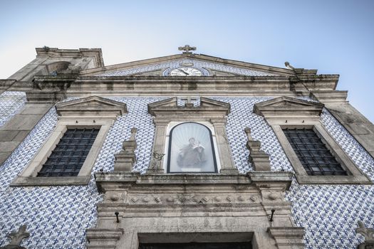 Ovar, Portugal - February 18, 2020: architectural detail of the Saint Anthony Church (Igreja De Santo Antonio) in the city center where people are walking on a winter day