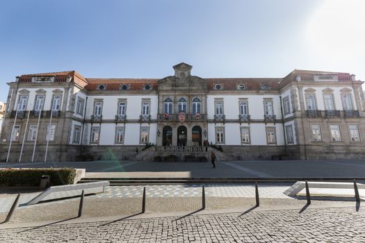 Ovar, Portugal - February 18, 2020: detail of architecture of the town hall in the historic city center where people walk on a winter day