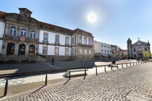 Ovar, Portugal - February 18, 2020: detail of architecture of the town hall in the historic city center where people walk on a winter day