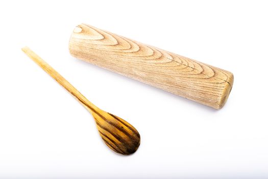 wooden spoon and rolling pin on white background in studio